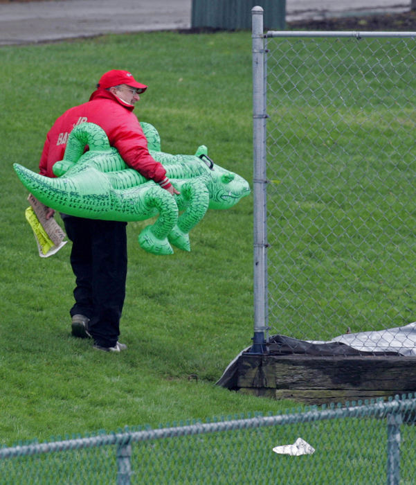 Third Place, Sports Picture Story - Phil Masturzo / Akron Beacon JournalA University of Akron fan heads home from Lee Jackson Field with his alligator floater in hand.  