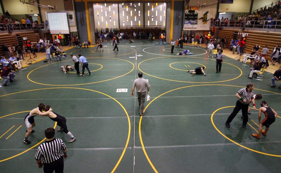Award of Excellence, Sports Picture Story - Tracy Boulian / The Plain DealerAt the tournament, wrestlers compete on seven mats at the same time in the morning, as they hope to win and advance to the next bracket, and eventually the finals in the afternoon. 