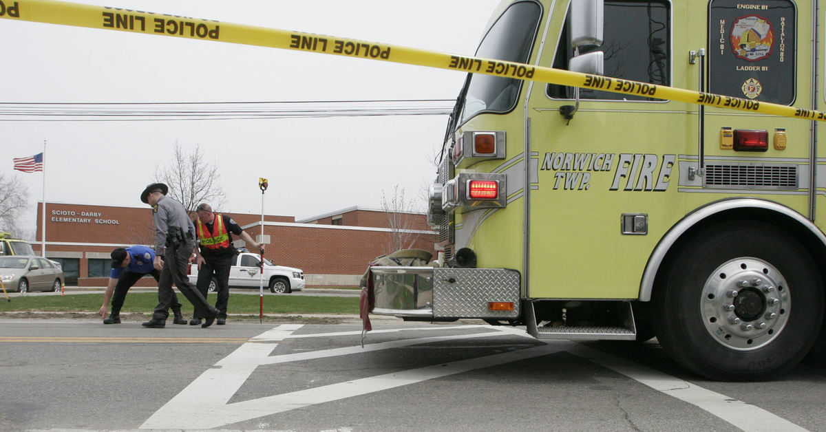 Second Place, Team Picture Story - Doral Chenoweht III / The Columbus DispatchCROSSING GUARD KILLED--Authorities investigate the crosswalk where a  man driving a dump truck hit and killed Dianna Sharp, an elementary school crossing guard, and injured Scioto Darby Elementary School second-grader Christian Engle as they crossed the street. Christian, 8, spent two weeks in Nationwide Children's Hospital.