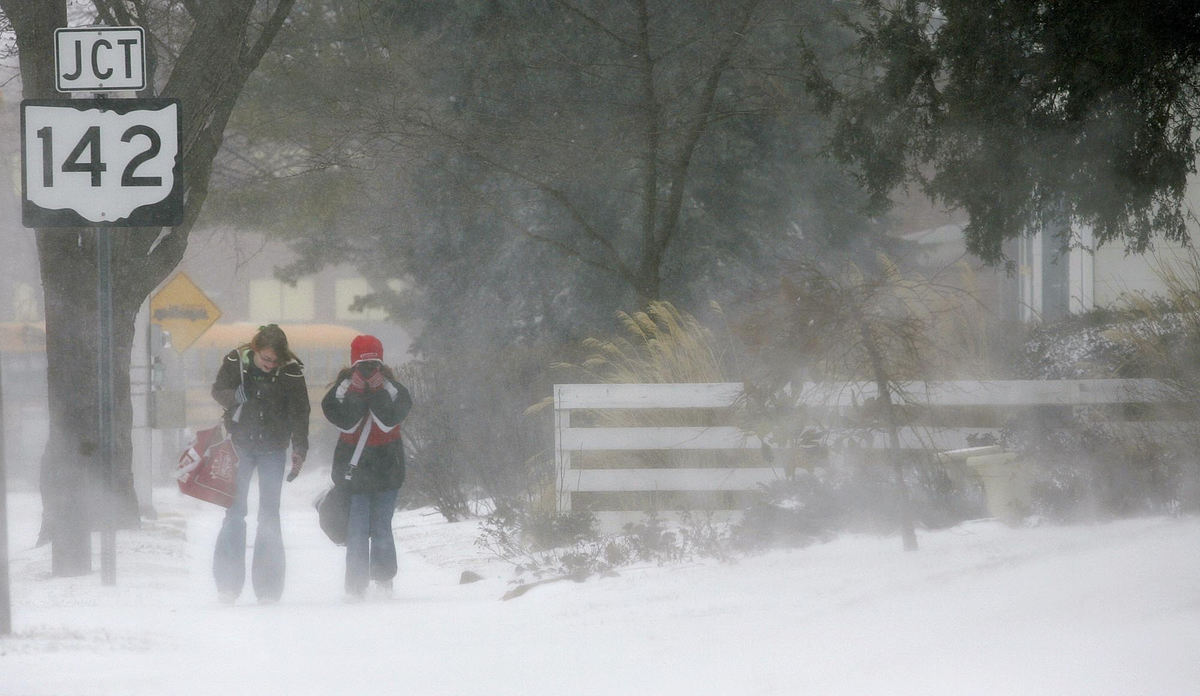 First Place, Team Picture Story - Jonathan Quilter / The Columbus DispatchLondon Middle School seventh-graders Isabel Lynch (left) and Darby Fisher (both 12) make their way east on Elm Street in London after London City Schools were closed early on March 7, 2008.