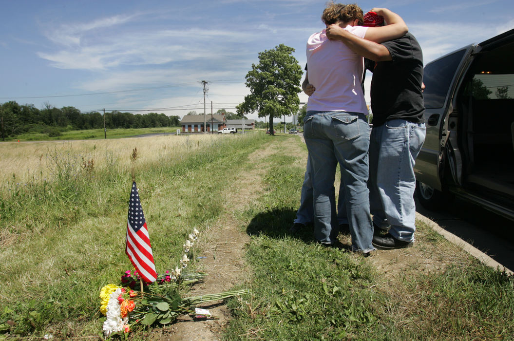 Third Place, Team Picture Story - Lynn Ischay / The Plain DealerMembers of Miktarian's band visit the site of their bandmate's death.  Miktarian was the first officer killed in the line of duty in the the Twinsburg police department's 56 year history. 