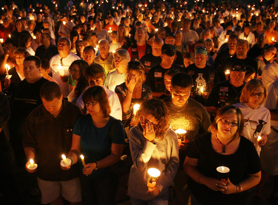 Third Place, Team Picture Story - Scott Shaw / The Plain DealerHundreds of people gathered in front of Twinsburg City Hall  to honor slain Patrolman Joshua Miktarian by candlelight.  Mourners, one-by-one, took a microphone and shared their thoughts on the officer. Among them were Miktarian's cousins, co-workers and police officers from other departments.  