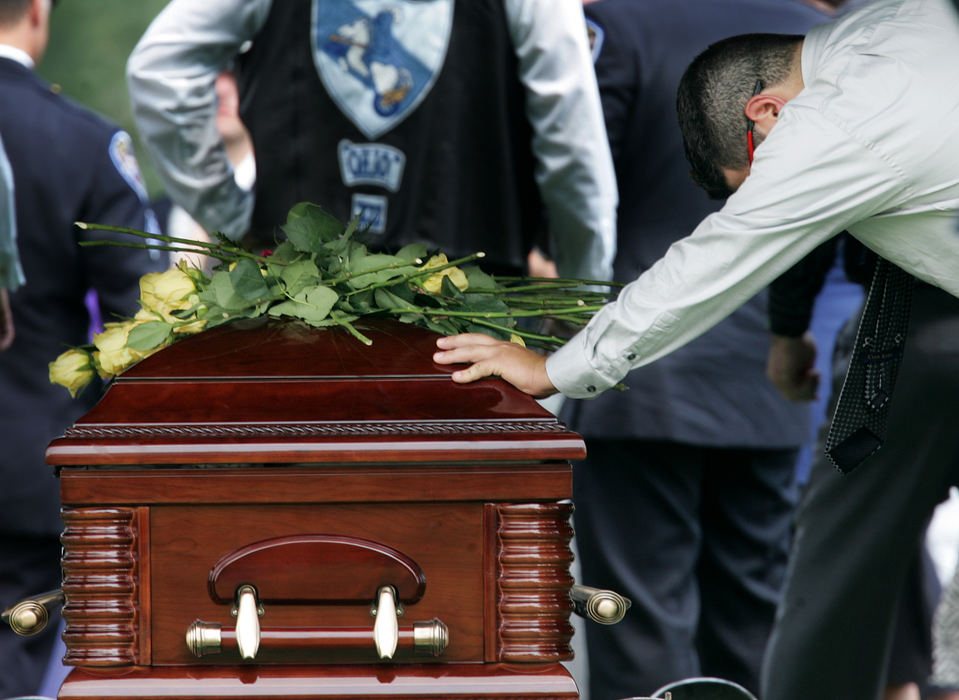 Third Place, Team Picture Story - John Kuntz / The Plain DealerThe ceremony drew to a close when Twinsburg retired Miktarian's badge number, 45.  A single officer spoke: "Last call for officer Joshua Miktarian."