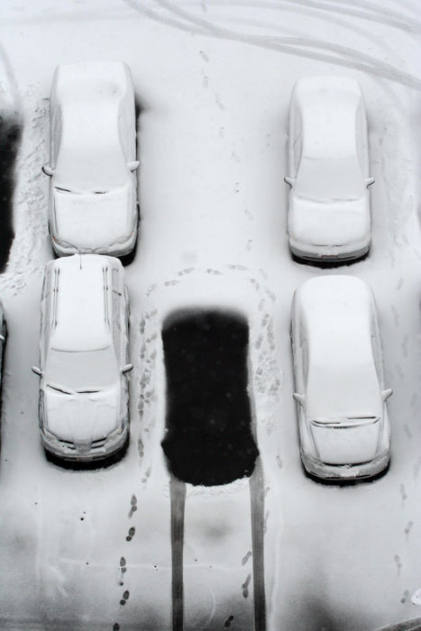 First Place, Team Picture Story - Karl Kuntz / The Columbus Dispatch An empty parking space shows the contrast between the snowfall and the recently emptied spot.  Many downtown workers went home early to avoid the a record 12 inches of snow .