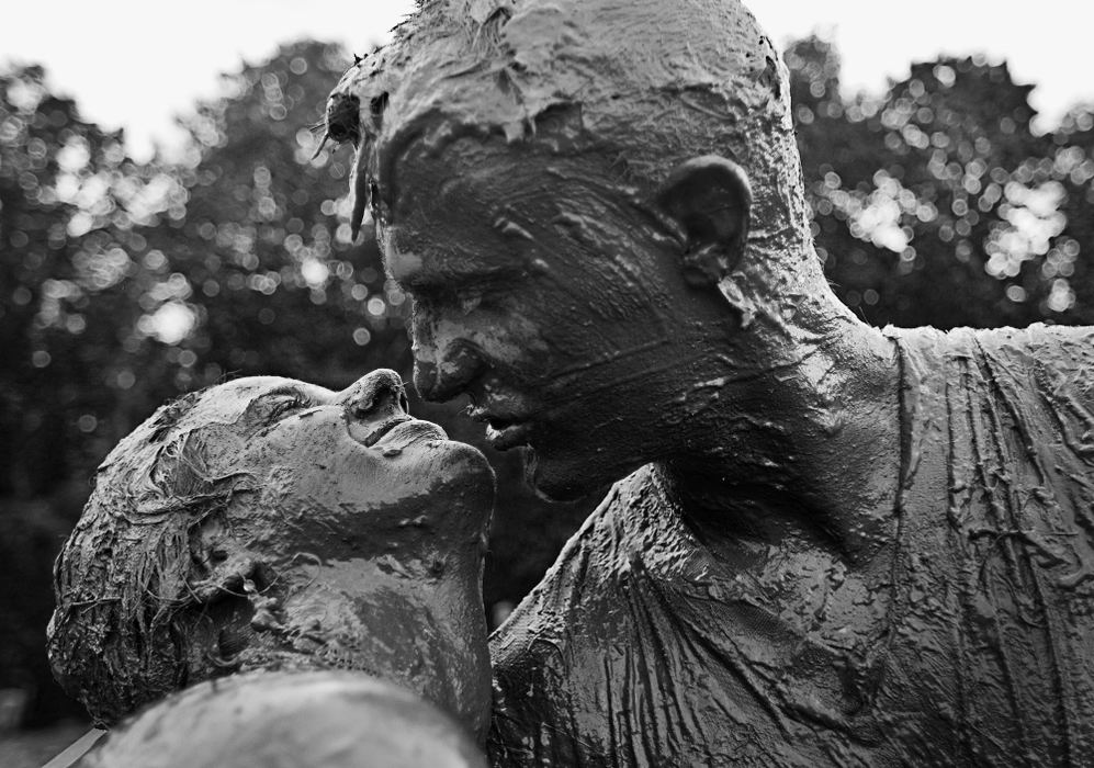 Award of Excellence, Feature - Diego James Robles / Ohio UniversityScott, a self-proclaimed alcoholic, shares a moment with his intoxicated girlfriend after hours of physical fighting in the middle or rain, mud and alcohol, during Six Fest, in Athens, May 16, 2009. Scott and his girlfriend often fight inebriated about his drinking problem. Almost 13,000 young people from Ohio and surrounding states attended Six Fest. Heavy rain and a massive amount of alcohol made the festival a wasteland of mud and intoxicated people.