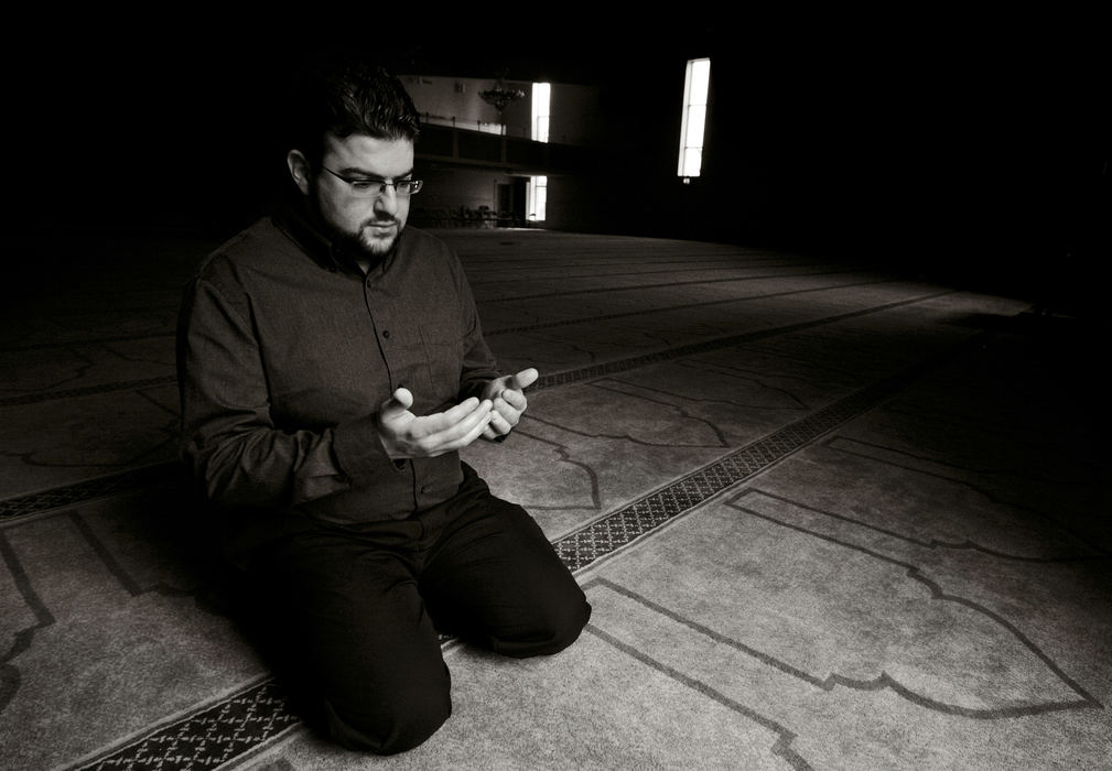 Second Place, Feature Picture Story - Andy Morrison / The BladeAmmar Alo faces northeast as he does one of his five daily prayers at Masjid Saad. Faith is "...what tells you that you're here for a reason; it's your map or your guide. Without it, you'd be lost. You would have no idea why you're here or what your purpose or goal is. Faith helps you make sense of this crazy world. For Muslims, we look at our religion as, not only being your religion, but your way of life. It's your whole daily routine. It's integrated into your everyday actions, so we do everything in accordance with Islamic principles."Ammar  Alo, Muslim, 26, Sylvania Township