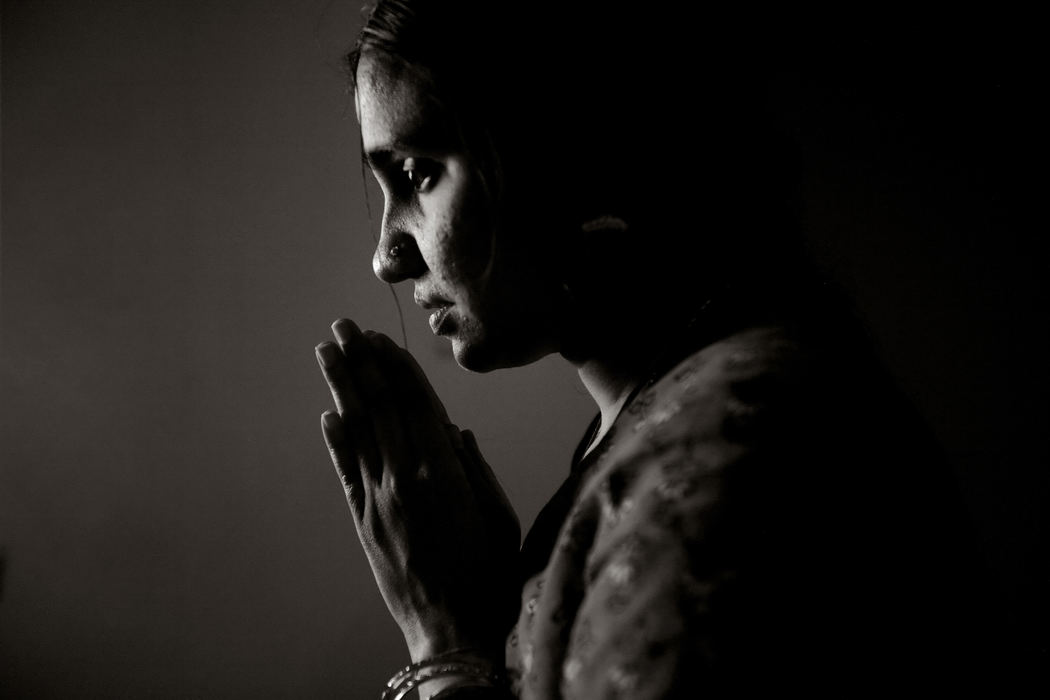 Second Place, Feature Picture Story - Andy Morrison / The BladeSumitra Srinivasan performs her daily prayers at her West Toledo home. Faith is "...believing in a higher authority, a higher cosmic power, and just a belief that there is God. In addition to being brought up with religious values and trust in God, it has also been a quest for understanding the scientific basis for things, what can't be understood by science. ... I continually question various teachings and their contexts, but on a more compelling side, I believe these have been said and passed to us through divine intervention. They may not have been proven or understood or accepted yet, but I want to believe."