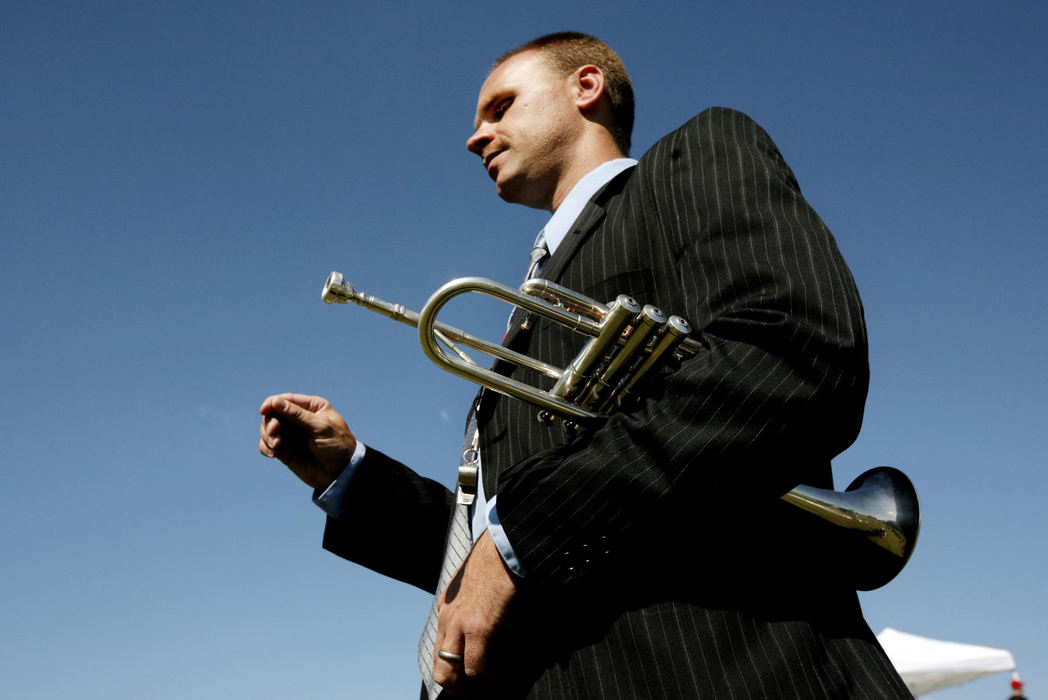 Third Place, Feature Picture Story - Fred Squillante / The Columbus DispatchOhio State School for the Blind marching band co-director Dan Kelley conducts a practice before the band takes the field for a halftime show during a football game at the Ohio School for the Deaf on Sept. 12, 2009 in Columbus. Like the members of his band, Kelley is also blind.