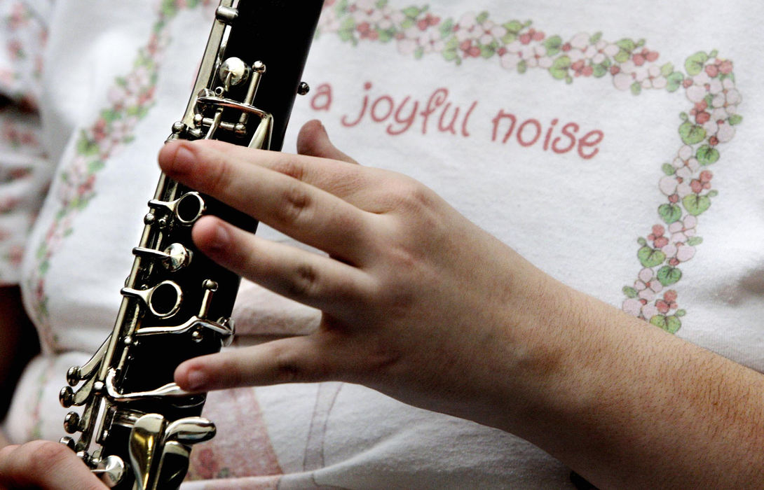 Third Place, Feature Picture Story - Fred Squillante / The Columbus DispatchOhio State School for the Blind marching band member Tamara Batchelder makes a joyful noise with her clarinet during band practice.