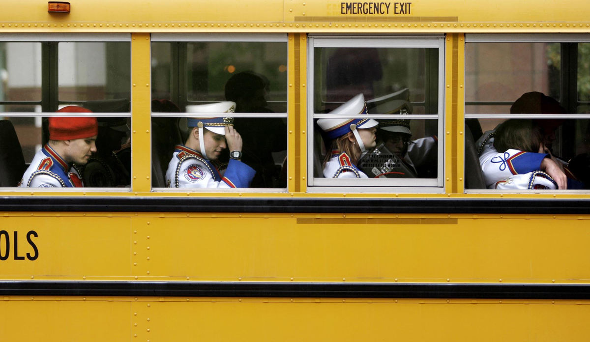 Third Place, Feature Picture Story - Fred Squillante / The Columbus DispatchMarching band members are ready for their bus ride back to school after a performance.