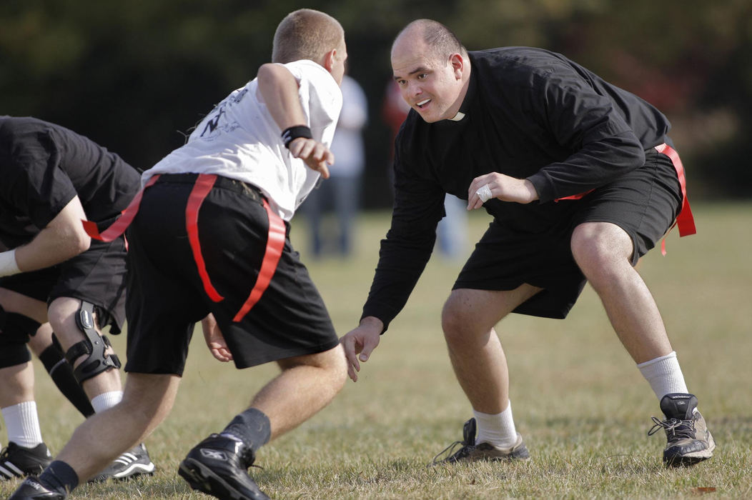 First Place, Feature Picture Story - Fred Squillante / The Columbus DispatchOffensive lineman Deacon Robert Bolding, right, shown in action during the annual Mudbowl flag football game at Pontifical College Josephinum.