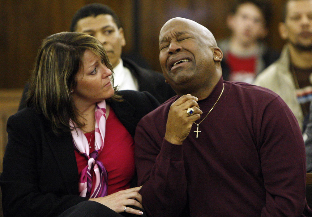 Award of Excellence, General News - Shari Lewis / The Columbus DispatchCatherine Fears comforts her husband Kenneth Fears as he is overcome with emotion during the hearing of Kenneth's brother Joseph Fears, who he had not seen in more than 25 years. Joseph Fears was released from prison after DNA tests proved he was innocent. 