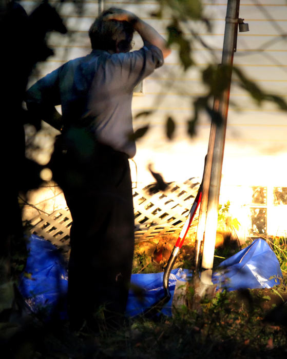 Second Place, News Picture Story - John Kuntz / The Plain DealerCuyahoga County coroners and Cleveland police dig up where a search and rescue dog marked earlier to what may be the remains of the fourth body recovered from convicted sex offender Anthony Sowell's home October 30, 2009 on the east side of Cleveland.  Sowell is still at large and believed to be in the Cleveland area.