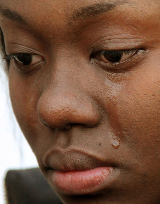 Second Place, News Picture Story - John Kuntz / The Plain DealerAndrayah Shabazz, daughter of Crystal Dozier who was announced by the Cuyahoga County coroners as a victim in the Anthony Sowell mass murders, cries as the family talks with the press November 7, 2009 in Cleveland.