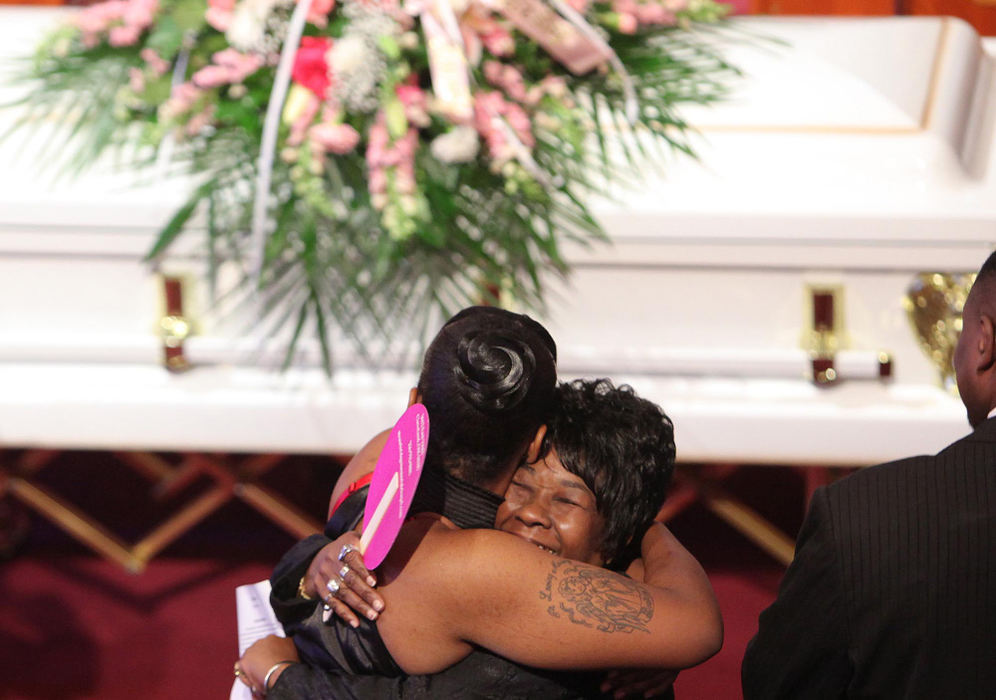 Second Place, News Picture Story - John Kuntz / The Plain DealerFlorence Bray (right) mother of Crystal Dozier who was identified as one of the 11 women found on the property of Alleged serial killer Anthony Sowell, receives a hug during the wake portion of Crystal's funeral service November 21, 2009 at the Mt. Olive Baptist Church in Cleveland. 