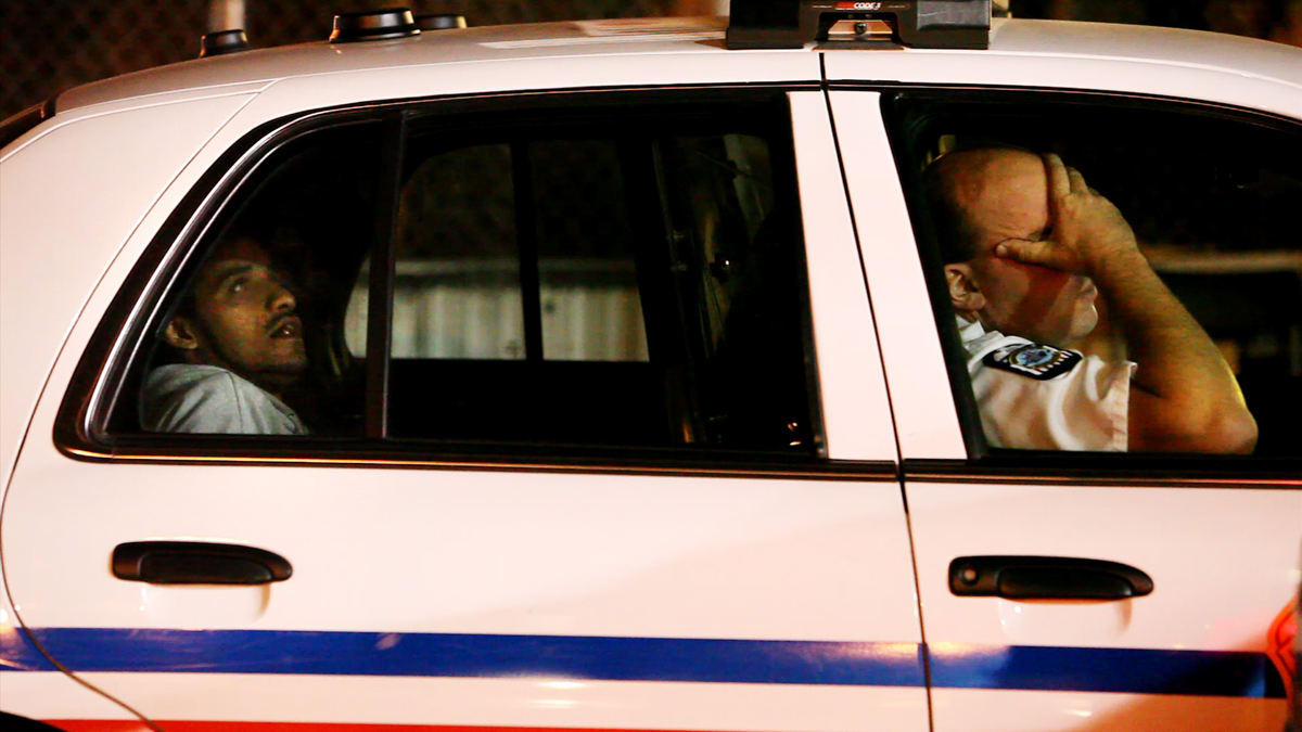 Third Place, News Picture Story - Courtney Hergesheimer / The Columbus DispatchColumbus police handled more than 6,600 domestic-violence cases last year. Officer Jonathan C. Dent (right) shows frustration after arresting Willie S. Johnson, 43, on a domestic-violence charge in September. Johnson later pleaded guilty to disorderly conduct.