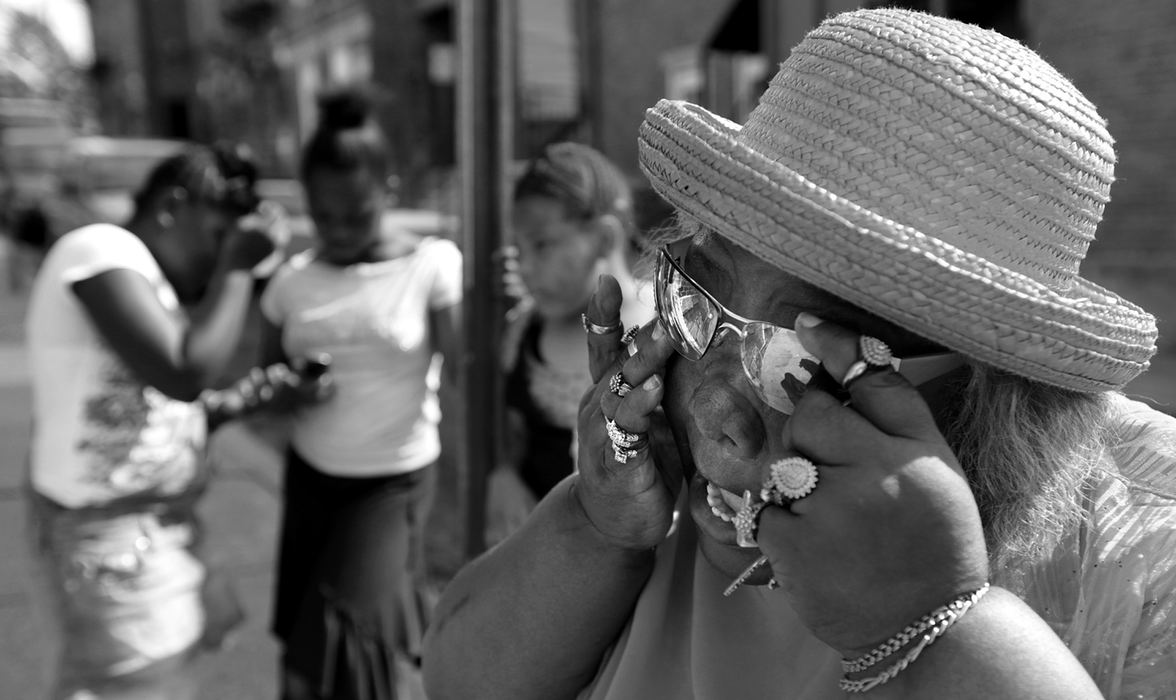 Award of Excellence, News Picture Story - Michael E. Keating / Cincinnati EnquirerSelma Vaughn wipes her eyes outside of the church as the funeral service nears and end. Shot dead were Noelle Washington, her 9-month-old son, Anthony Jones, and Sharailyn Wright, a 3-year-old girl for whom Washington was babysitting. A neighborhood reacts with a prayer vigil, emotional funeral services including a mime's tribute dance. The killer has not been caught. 