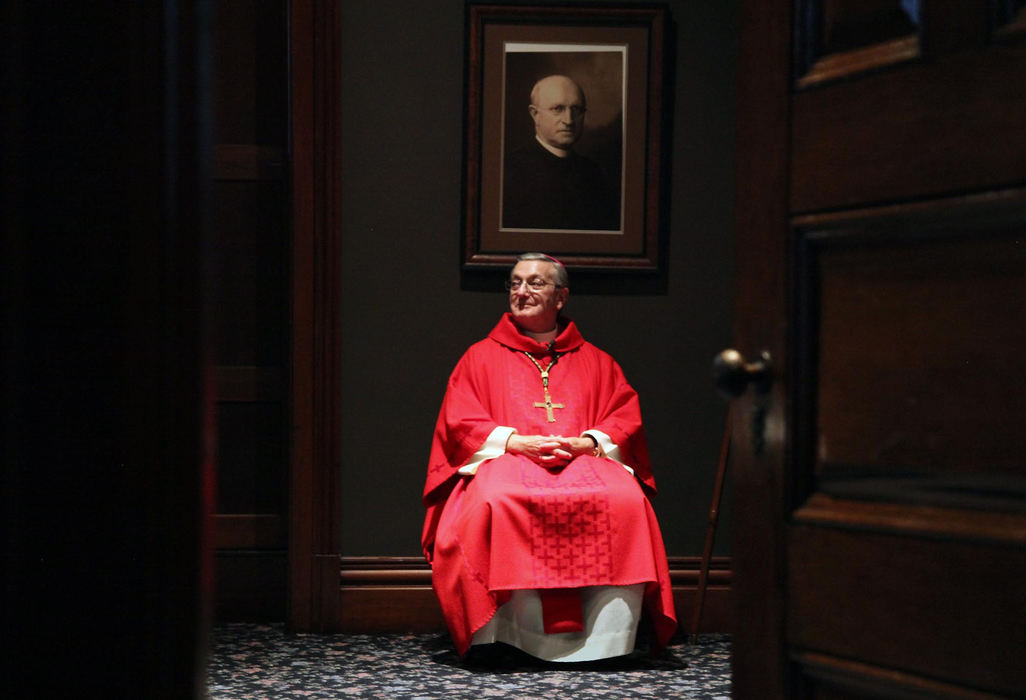 First Place, James R. Gordon Ohio Understanding Award - Gus Chan / The Plain DealerBishop Anthony Pilla, Bishop Emeritus, waits before the mass to celebrate the 150th anniversary of Historic St. Peter Church.  The oldest continuing church will close it's doors for the final time next April as part of the church downsizing.  Pilla served as bishop before retiring.  His position was filled by the current bishop, Richard Lennon.