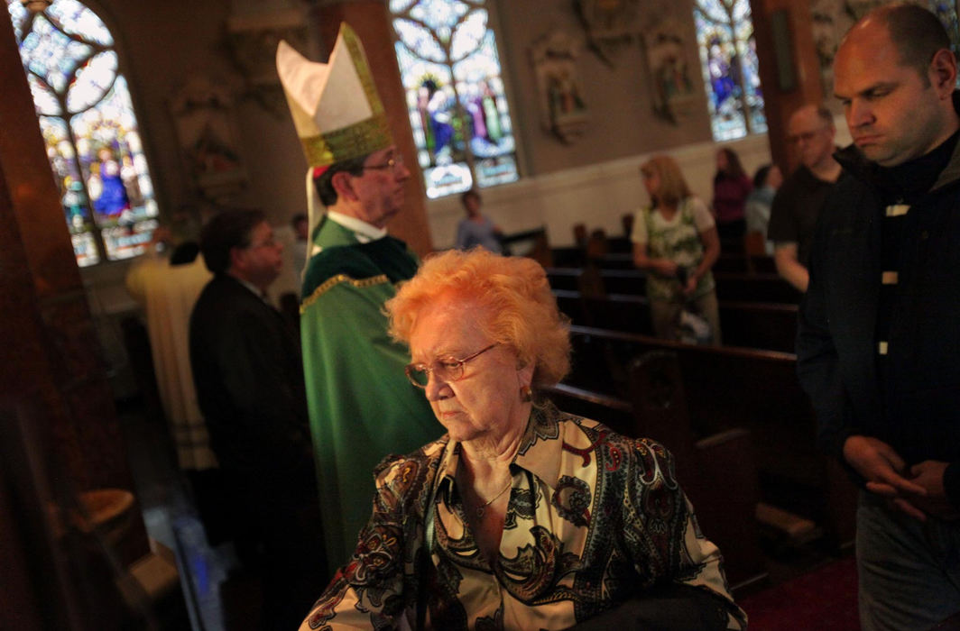 First Place, James R. Gordon Ohio Understanding Award - Gus Chan / The Plain DealerParishioners from St. Casimir Church snub Bishop Richard Lennon as they walk past without greeting him after the closing mass.