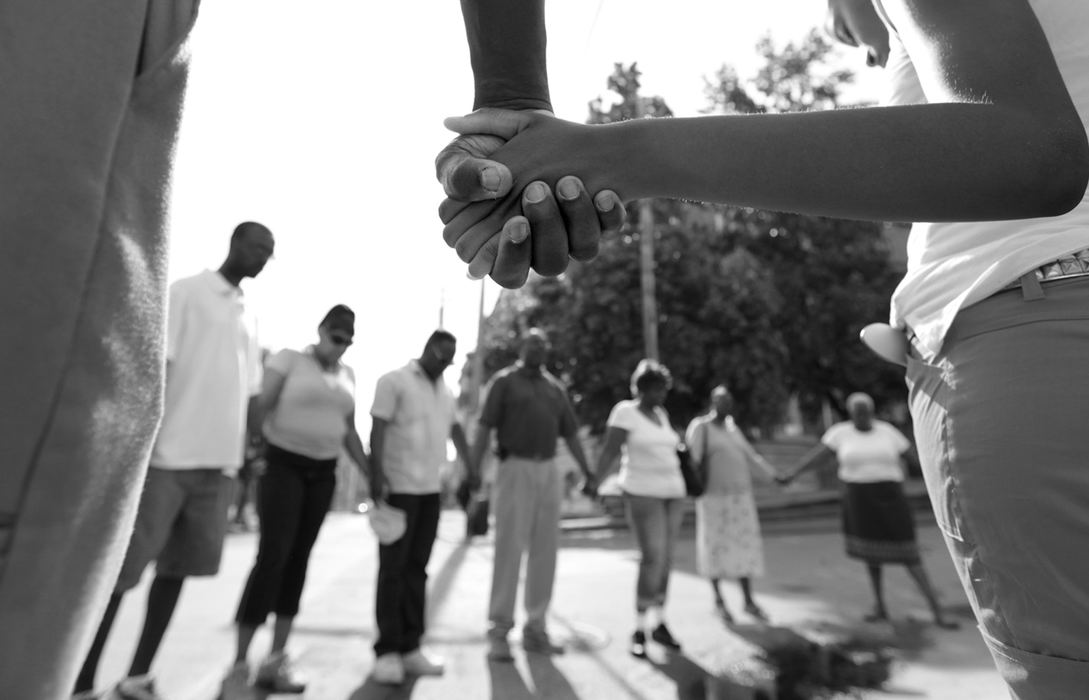 Award of Excellence, Photographer of the Year Large Market - Michael E. Keating / Cincinnati EnquirerShot dead were Noelle Washington, her 9-month-old son, Anthony Jones, and Sharailyn Wright, a 3-year-old girl for whom Washington was babysitting. A neighborhood reacts with a prayer vigil, emotional funeral services including a mime's tribute dance. The killer has not been caught. 