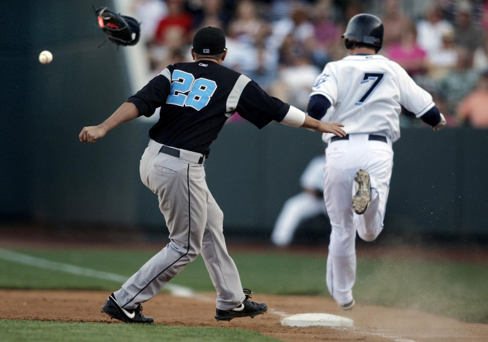 First Place, Photographer of the Year Large Market - Fred Squillante / The Columbus DispatchSyracuse Chiefs first baseman Kory Casto (28) loses his glove and the ball when Columbus Clippers Trevor Crowe (7) runs into the tag at first base in the first inning during a baseball game at Huntington Park in Columbus.