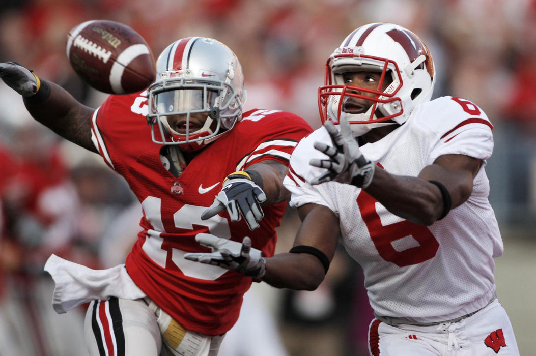 First Place, Photographer of the Year Large Market - Fred Squillante / The Columbus DispatchOhio State's Andre Amos (13) defends against a pass in the end zone to Wisconsin's Isaac Anderson (6) that fell for an incompletion during the third quarter at Ohio Stadium in Columbus.