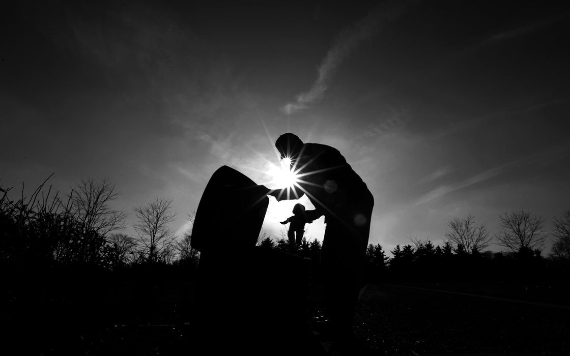 Award of Excellence, Photographer of the Year Large Market - Michael E. Keating / Cincinnati EnquirerCustodian Tom Hughes from Gate of Heaven Cemetery places a plastic doll in a storage container left at a gravesite in the Baby Garden portion of the cemetery. The container keeps the items left at grave safe and dry.  They are removed from the gravesite monthly and placed in the container if they are in good condition.