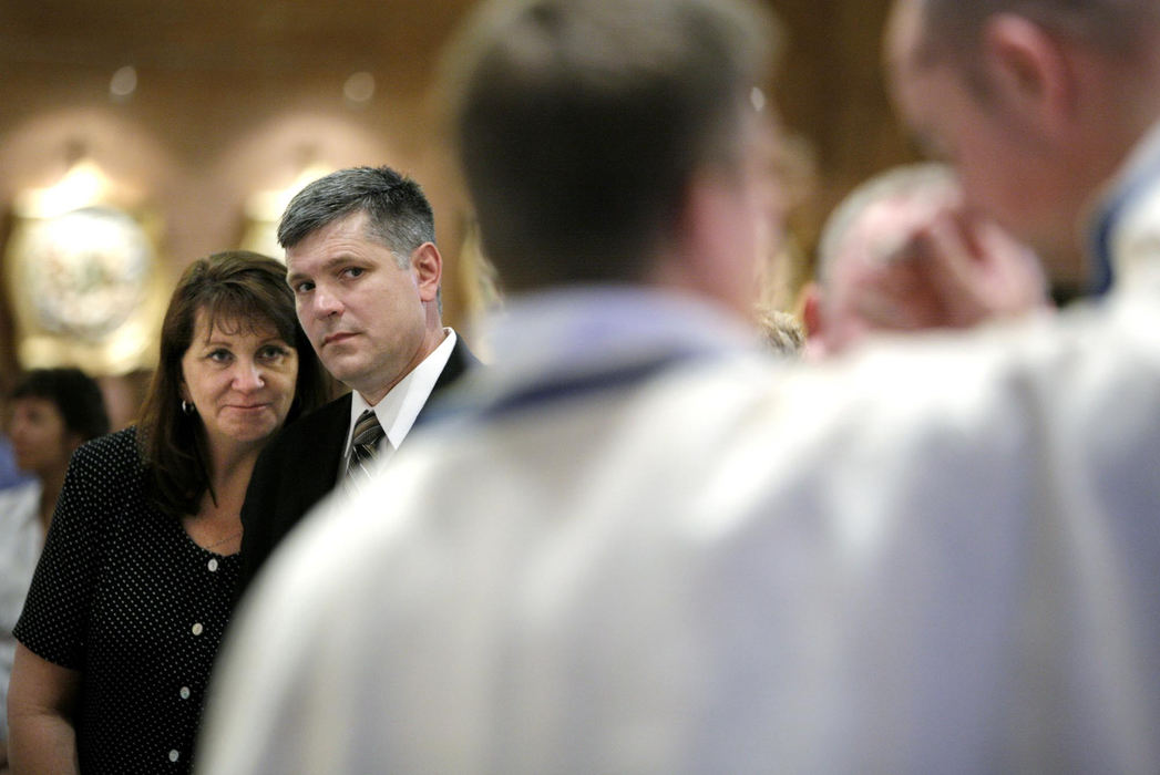 First Place, Photographer of the Year Large Market - Fred Squillante / The Columbus DispatchRobert Bolding's parents, Patty and Al watch as Robert, far right, dons a priest vestment during his ordination ceremony at Saints Simon and Jude Cathedral in Phoenix, Arizona.