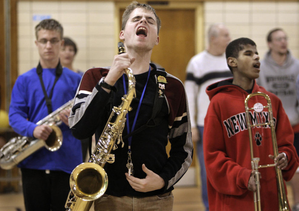 First Place, Photographer of the Year Large Market - Fred Squillante / The Columbus DispatchOhio State School for the Blind marching member Marty Bateman, center foreground, responds to band co-director Dan Kelley's call for band members to come to attention during practice in the school's gym.