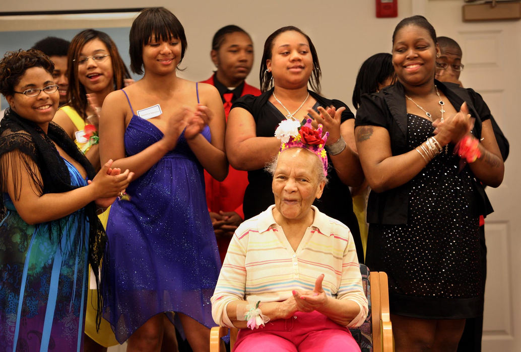 Second Place, Photographer of the Year Large Market - Gus Chan / The Plain DealerCleota Lovett receives a round of applause from Shaw High School students as she's crowned Duchess of the Senior to Seniors Prom.   Seniors from Shaw High School participated in the event with residents of McGregor Home.   