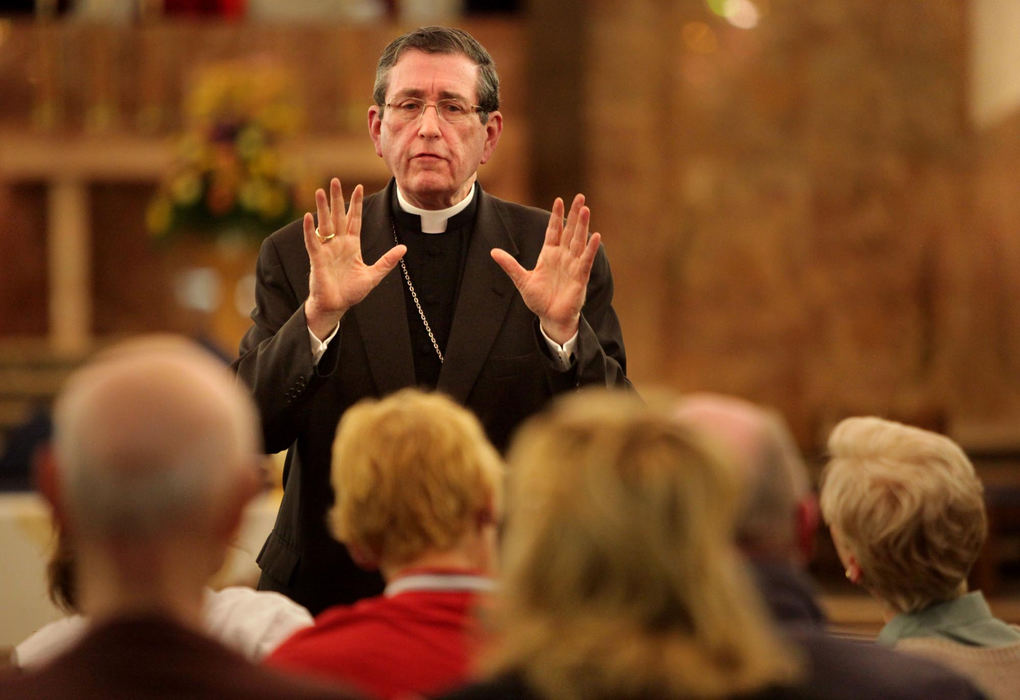 Second Place, Photographer of the Year Large Market - Gus Chan / The Plain DealerBishop Richard Lennon implores a group of protesters to vacate the closed St. John the Baptist Church.  Bishop Lennon was at the Akron church to preside over the final mass.  