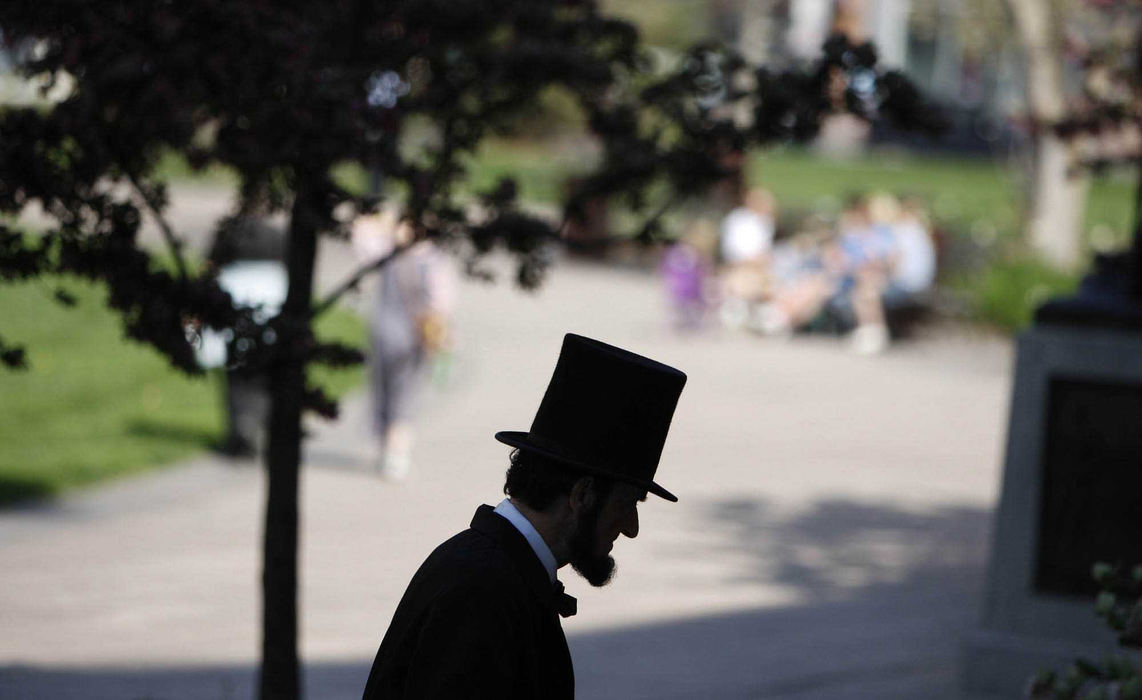 First Place, Photographer of the Year Large Market - Fred Squillante / The Columbus DispatchPete Raymond casts a familiar profile as Abraham Lincoln at the Ohio Statehouse 12th Civil War Encampment. Raymond, a life member of the Association of Lincoln Presenters, was getting ready to give a speech as Lincoln on the Statehouse grounds as part of the celebration of the bicentennial of Lincoln's birth (1809-2009).