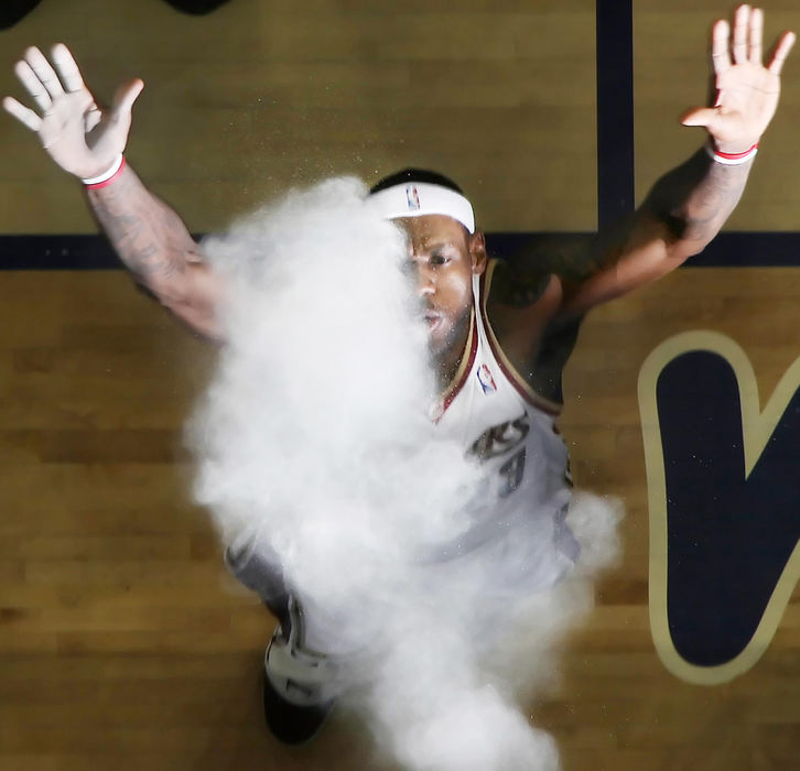 Third Place, Photographer of the Year Large Market - John Kuntz / The Plain DealerCleveland Cavaliers LeBron James performs his pregame ritual of throwing up a handful of talc powder and blowing up in the air May 20, 2009 during the first game of the Eastern Conference Finals against the Orlando Magic at Quicken Loans Arena.  