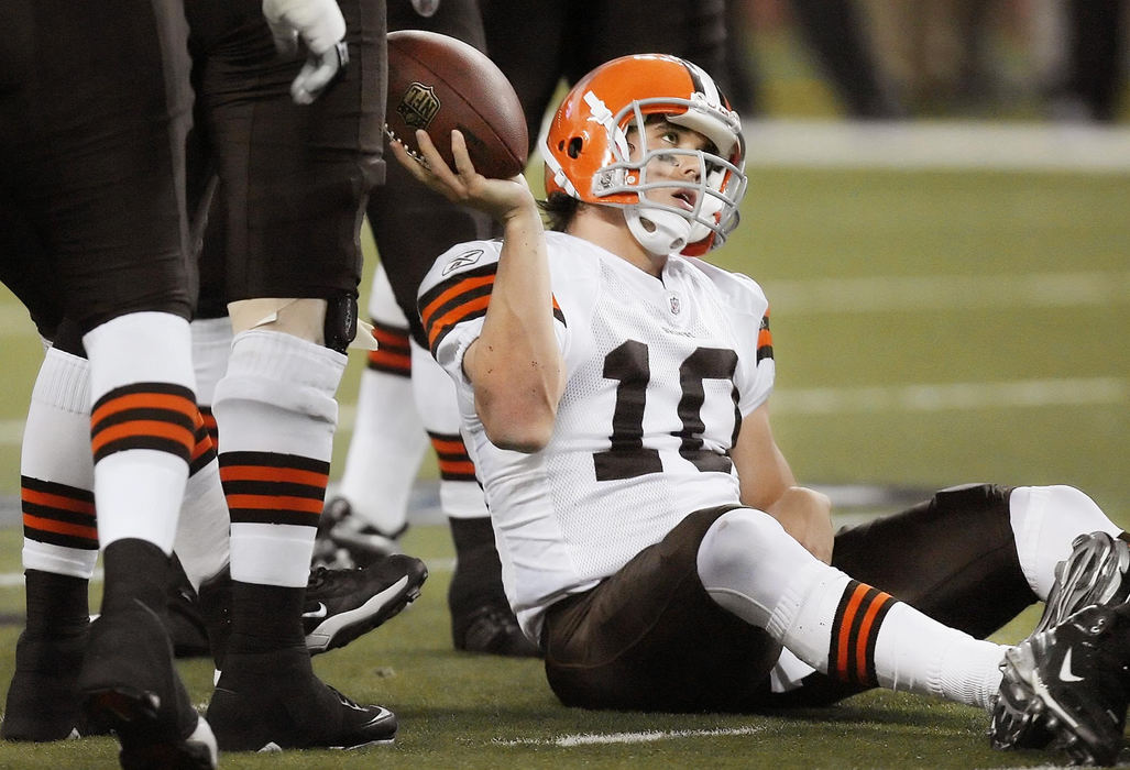 Third Place, Photographer of the Year Large Market - John Kuntz / The Plain DealerCleveland Browns quarterback Brady Quinn gives the ball to a referee after tripping and falling on a snap in the second quarter where the offense stalled against the Detroit Lions November 22, 2009 at Ford Field in Detroit, Michigan.  Detroit scored a touchdown as time expired on the clock and won the game by kicking the extra point beating the Browns, 37-38.  