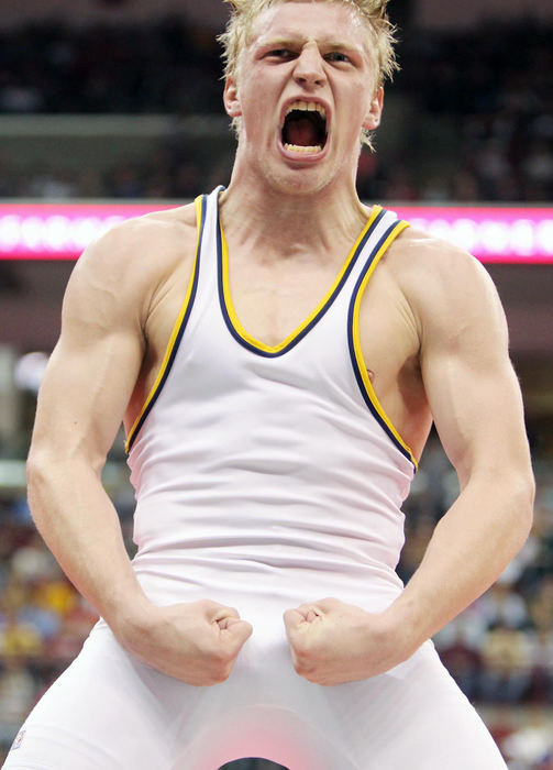 Third Place, Photographer of the Year Large Market - John Kuntz / The Plain DealerSt. Ignatius' David Habat lets out a roar after beating New Carlisle Tecumseh's T.J. Rigel to win the 145-pound Division I state championship in Columbus.
