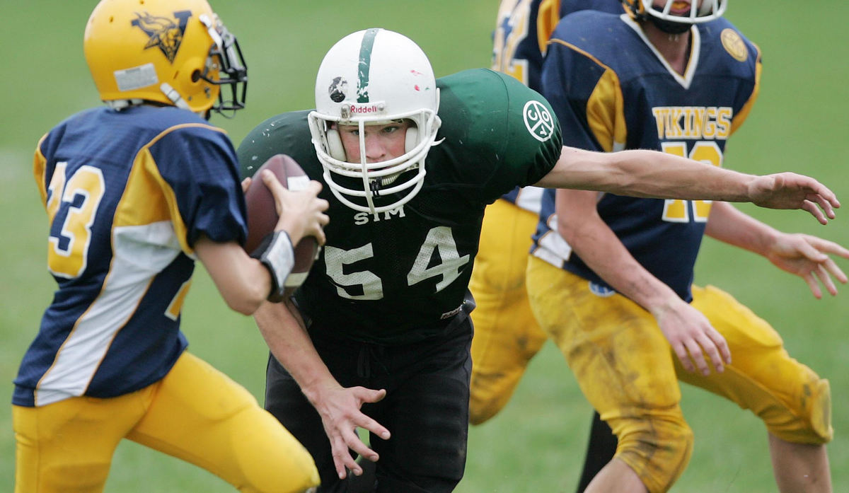 Third Place, Photographer of the Year Large Market - John Kuntz / The Plain DealerIan Stuart pursues the Vikings quarterback as Ian pressures him out of the pocket in the first half of St. Thomas More School's game against SSJ September 28, 2008.  