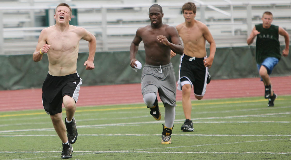 Third Place, Photographer of the Year Large Market - John Kuntz / The Plain DealerIan Stuart leads the pack of defensive freshman players during the first workout for freshman St. Edwards football team in Lakewood July 22, 2009.    