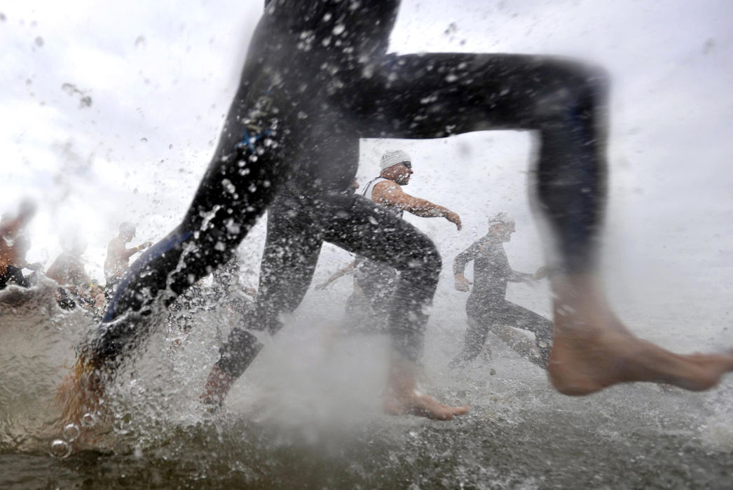 First Place, Photographer of the Year Small Market - Bill Lackey / Springfield News-SunParticipants in the Great Buckeye Challenge Triathlon splash into C.J. Brown Reservoir as they start the swimming portion of the event, August 23. Nearly 700 competitors pushed their bodies to the limit as they swam, biked and ran around Buck Creek State Park.   