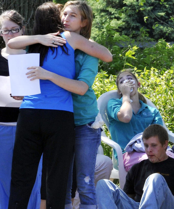 First Place, Photographer of the Year Small Market - Bill Lackey / Springfield News-SunEmotions were high as family members arrived on the scene of the bus crash to find out if their children were injured or safe. 