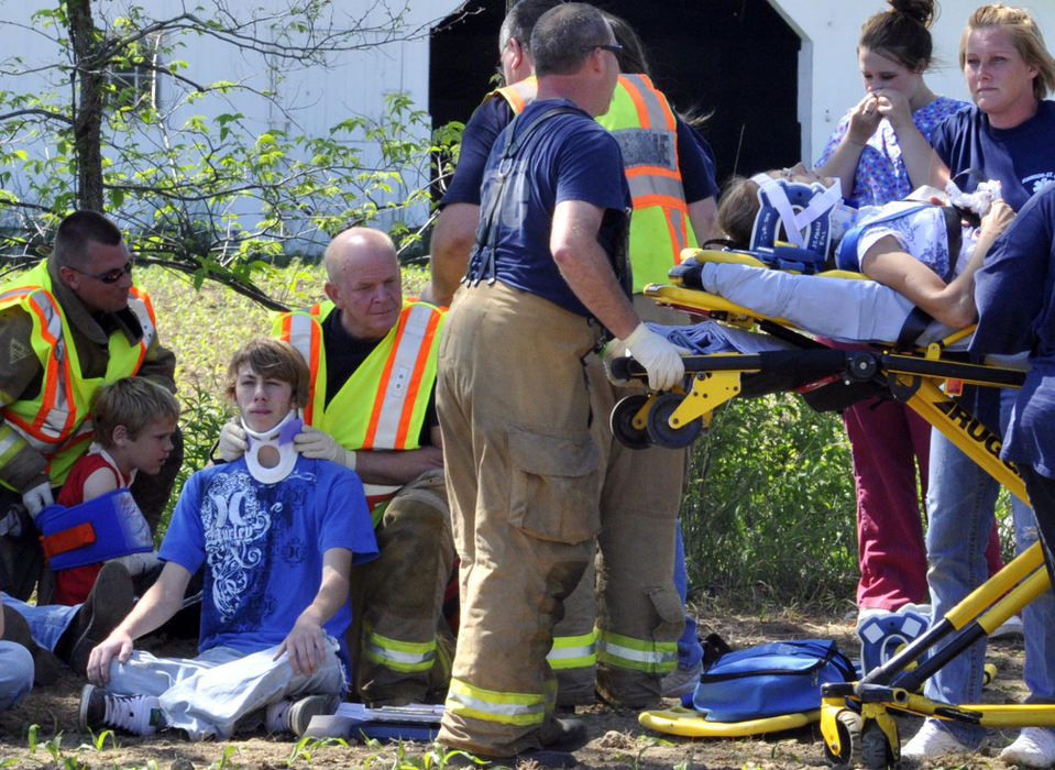 First Place, Photographer of the Year Small Market - Bill Lackey / Springfield News-SunInjured Graham students are treated by Champaign County emergency personnel after their bus was involved in a head-on collision with a mini-van. 