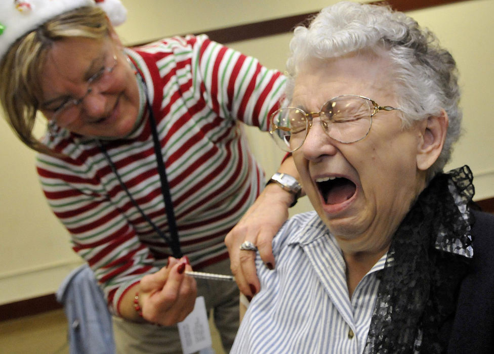 Second Place, Photographer of the Year Small Market - Marshall Gorby / Springfield News-SunCatherine Buba reacts to getting her H1N1 vaccine shot from Carolyn Gilliam at the all-inclusive vaccine clinic, Dec. 15 at the Clark County Fairgrounds. The general public was able to receive the H1N1 vaccine for the first time this week in Clark County. 