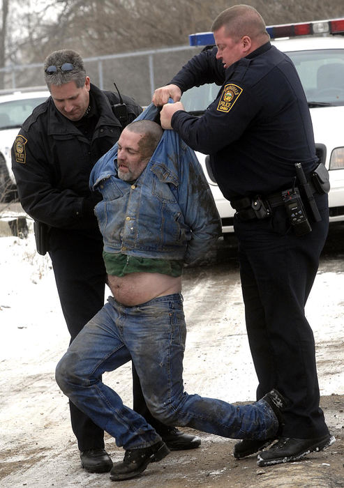 Second Place, Photographer of the Year Small Market - Marshall Gorby / Springfield News-SunSpringfield police took this man into custody after a hit-and-run and foot chase near the 1200 block of Perry Street around 2 p.m., Jan. 9. Floyd Skaggs allegedly fled the scene of the crash near 721 N. Bechtle Ave., then reportedly hid his vehicle in the 1100 block of Hillcrest Avenue. Skaggs then fled on foot and was apprehended by Springfield police minutes later. 