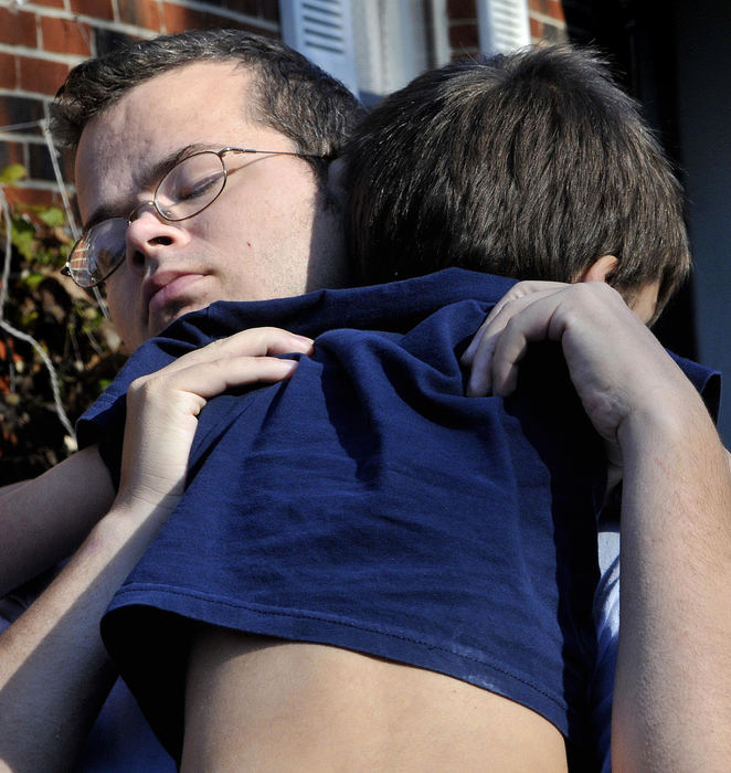 Second Place, Photographer of the Year Small Market - Marshall Gorby / Springfield News-SunDanny Richardson, 6, is hugged by his father after being rescued by firefighters from the top of a 40 foot tree, Nov. 7.