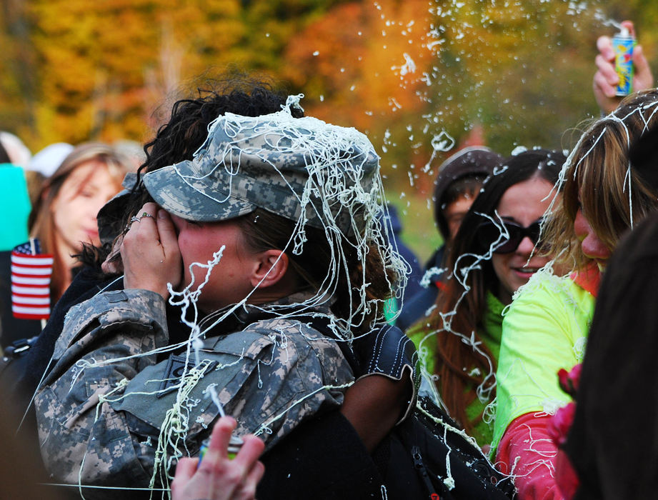 Third Place, Photographer of the Year Small Market - Tessa Bargainnier / Kent State UniversityFriends and family shower Spc. Jessica Czerr with silly string as she arrives the 135th Military Police Company Welcome Home Ceremony & Freedom Salute at Kenston High School. Activated Nov. 11, 2008, Czerr's unit spent nearly a year in Iraq. 