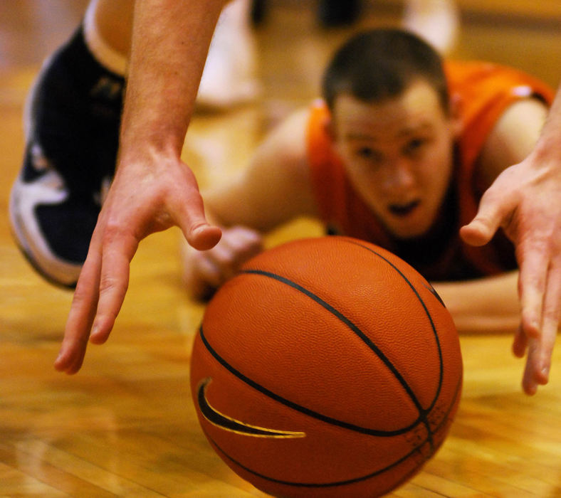 Third Place, Photographer of the Year Small Market - Tessa Bargainnier / Kent State UniversityKent State senior center Brandon Parks recovers the ball from Bowling Green sophomore forward Scott Thomas during the Flashes’ 76-70 loss to the Falcons.