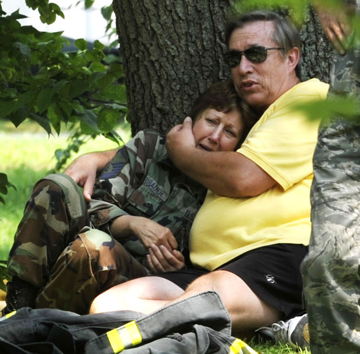 First Place, Photographer of the Year Small Market - Bill Lackey / Springfield News-SunThe owners of a home at 5811 Hunter Rd. in Enon console each other in their front yard after arriving home to find their house completely destroyed by a fire, Aug. 15, 2009. 