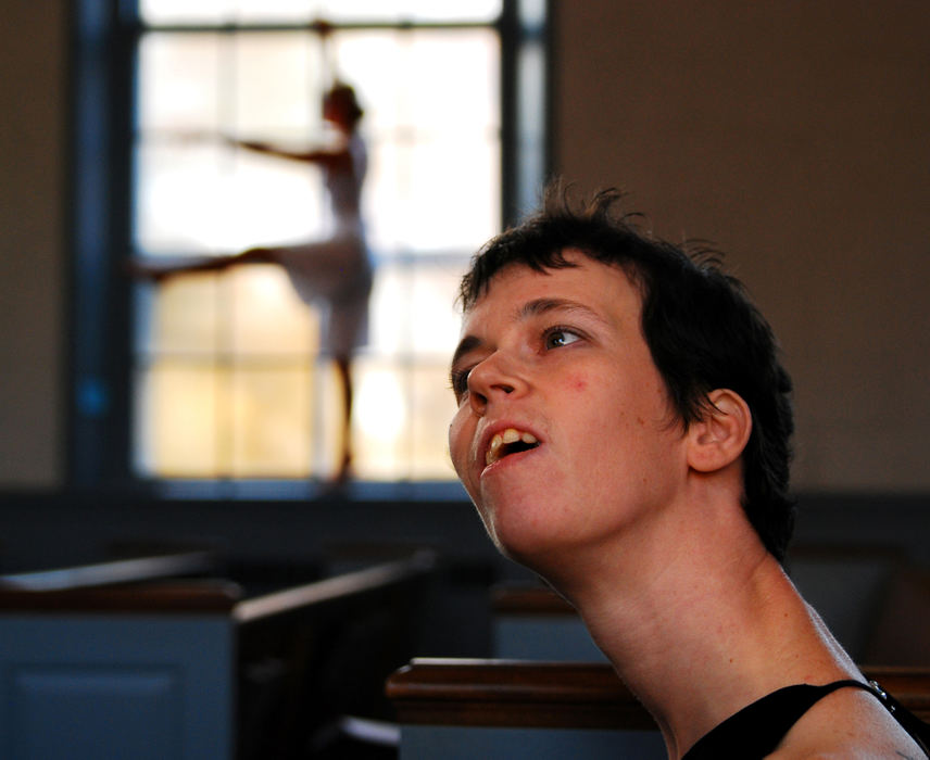 Third Place, Photographer of the Year Small Market - Tessa Bargainnier / Kent State UniversityAllie sits in the pews of First Unitarian Church of Cleveland in Shaker Heights as she watches fellow dancers perform in the windows for a Verlezza Dance Company concert.