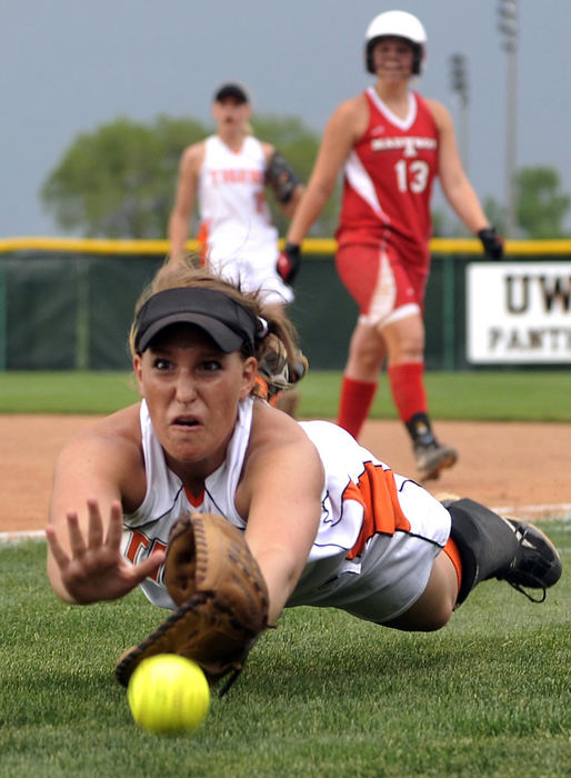 First Place, Photographer of the Year Small Market - Bill Lackey / Springfield News-SunWest Liberty-Salem High School first baseman Kate Detwiler dives for a foul ball during the Division III regional semi-final game against Madison High School, May 27, 2009. 