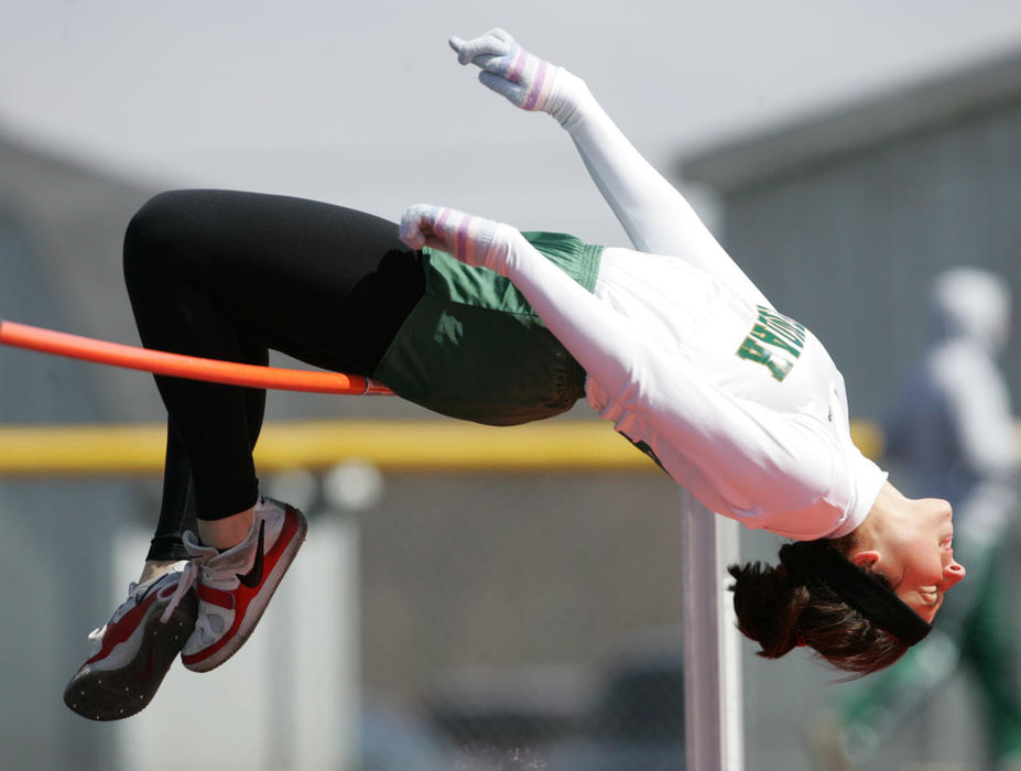 Third Place, Sports Action - Karen Schiely / Akron Beacon JournalGlen Oak high jumper Dana Devore crosses her fingers as she attempts to clear the 5ft.-3 inch bar during the Don Faix Memorial Track Invitational at Crestwood High School April 4, 2009 in Mantua. 
