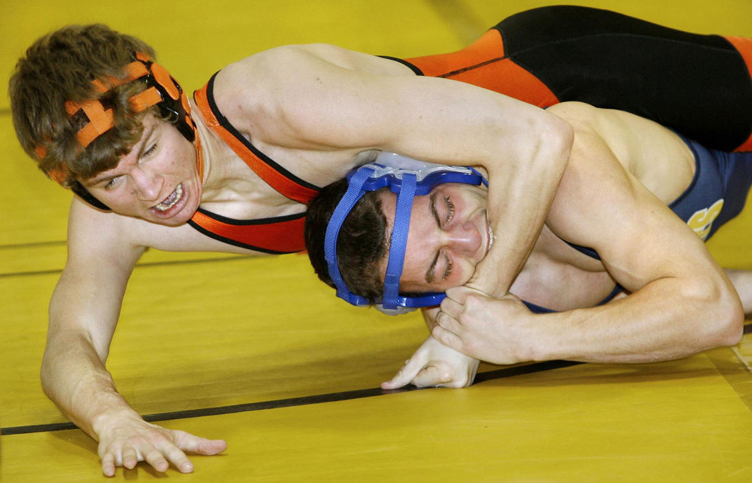 Award of Excellence, Sports Action - Barbara J. Perenic / Springfield News-SunJustin Sloan of National Trail reacts as he is bitten by Cody Fields of Springfield while wrestling at 140 lbs. during the Shawnee Invitational. No foul was called by officials.